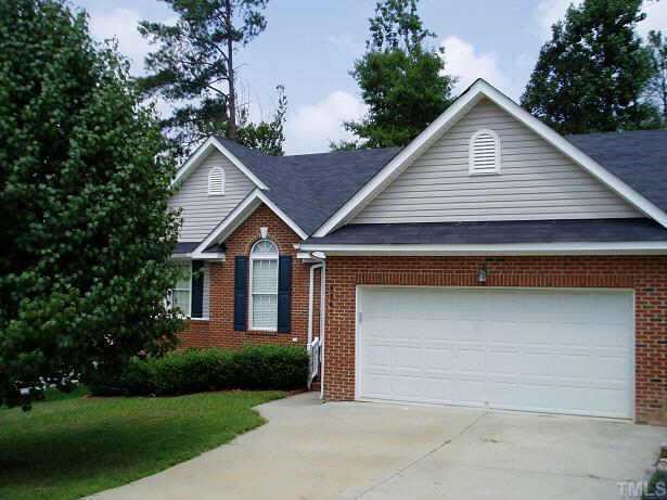 3361 Neptune Drive Raleigh, NC 27604 - Photo 1 of 1 a front view of a house with a yard and garage