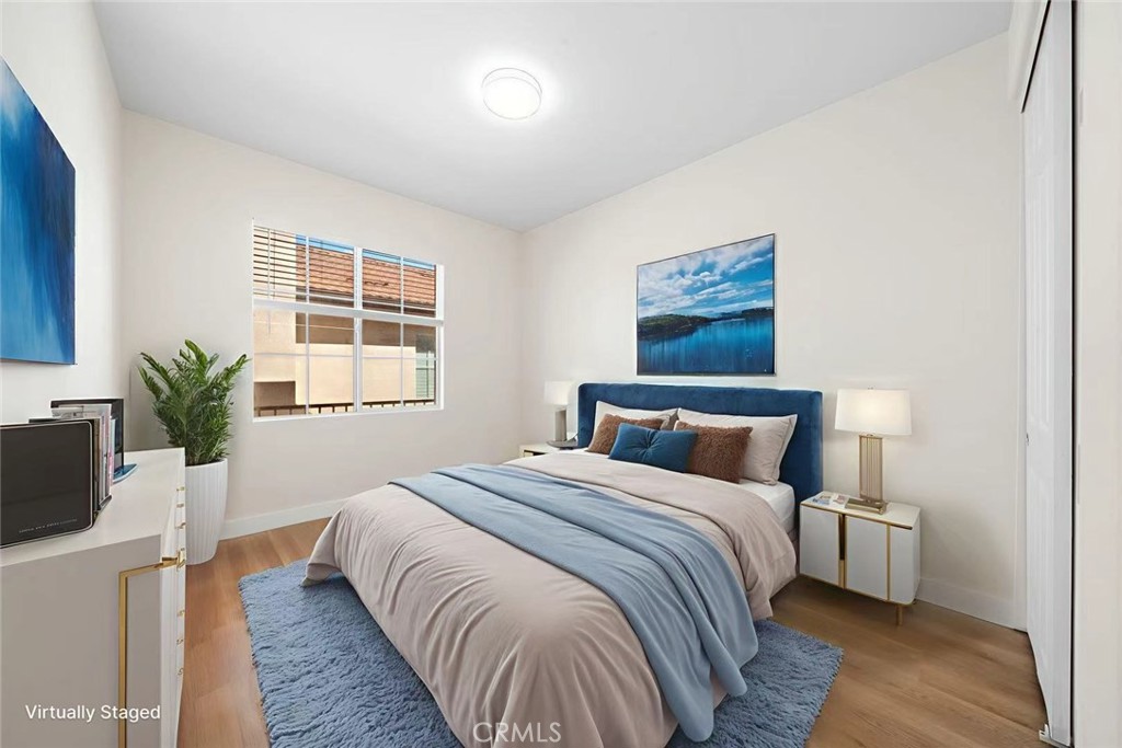 4539 Rivergate Court Riverside, CA 92505 - Photo 13 of 29 a bedroom with a large bed and a potted plant