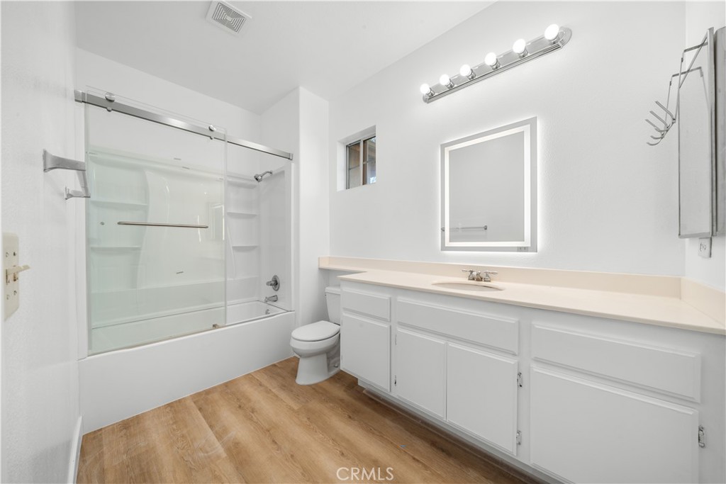 4539 Rivergate Court Riverside, CA 92505 - Photo 19 of 29 a bathroom with a sink a toilet and shower