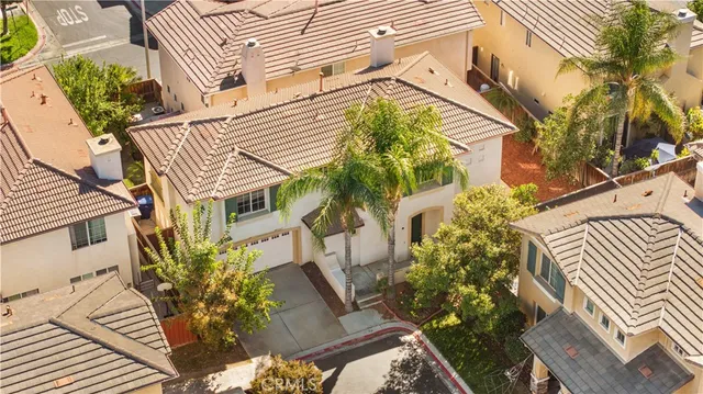 an aerial view of a residential apartment building with a yard