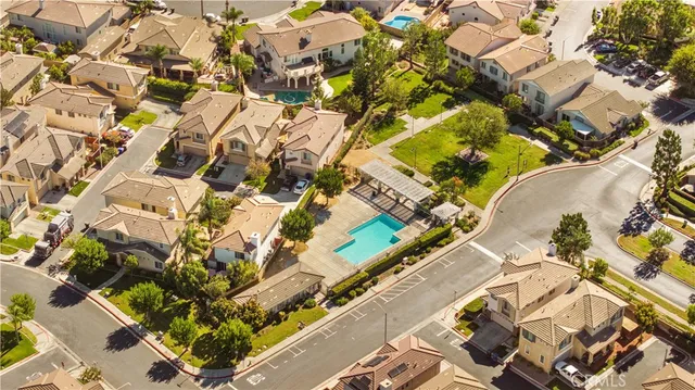 an aerial view of residential houses with outdoor space