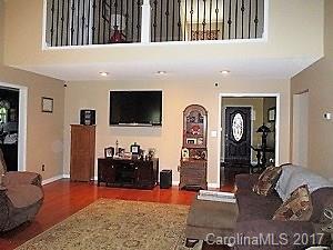 1610 Center Road Chester, SC 29706 - Photo 11 of 24 a living room with furniture a flat screen tv and a large window