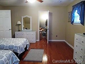 1610 Center Road Chester, SC 29706 - Photo 13 of 24 a bedroom with a bed and wooden floor