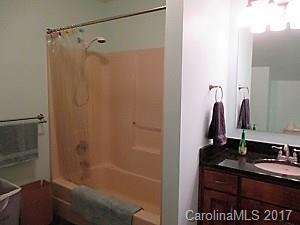 1610 Center Road Chester, SC 29706 - Photo 16 of 24 a bathroom with a granite countertop sink a mirror and shower