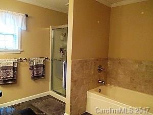 1610 Center Road Chester, SC 29706 - Photo 18 of 24 a bathroom with a tub and sink