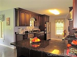 1610 Center Road Chester, SC 29706 - Photo 5 of 24 a kitchen with a refrigerator stove and sink