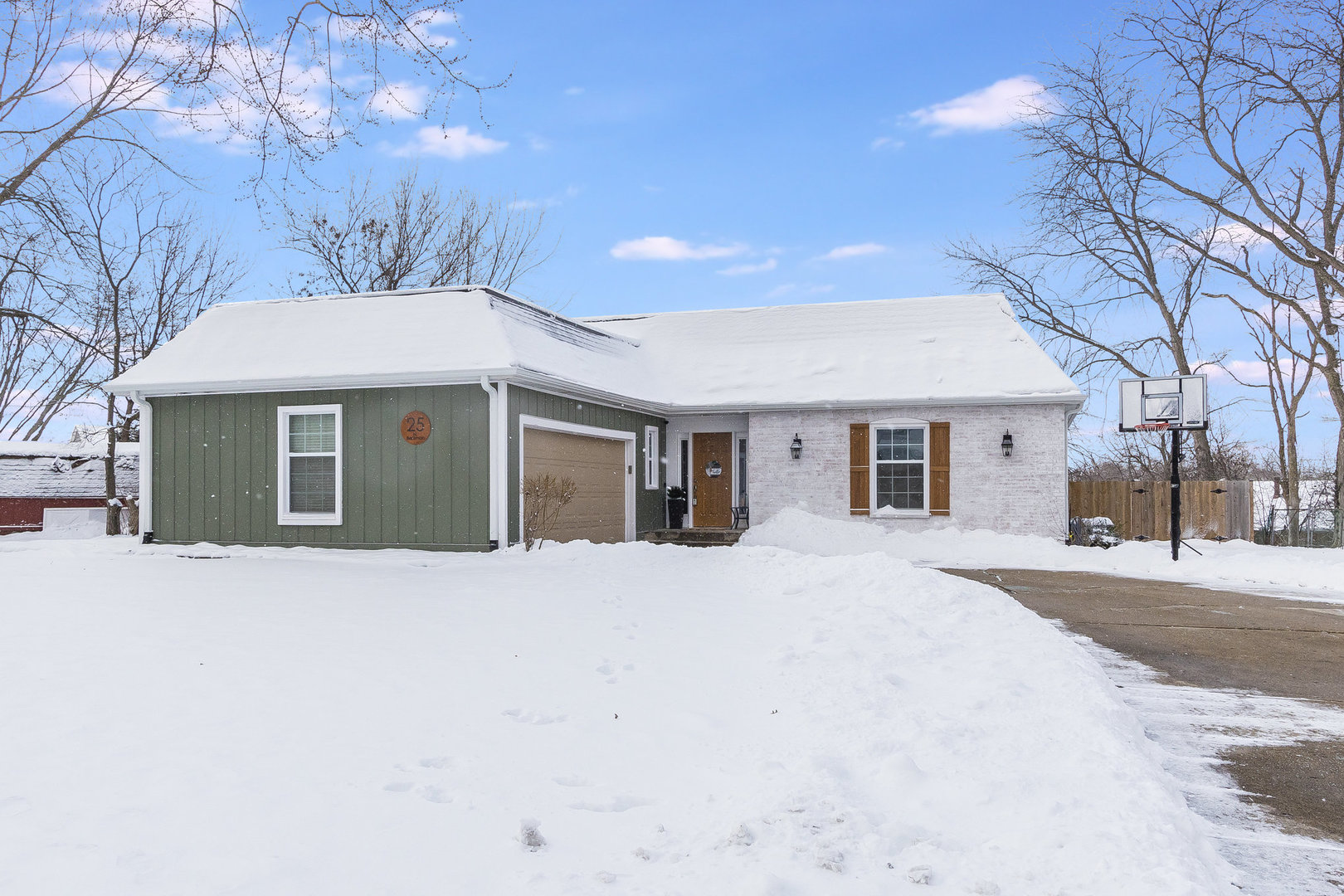 25 North Bereman Road Montgomery, IL 60538 - Photo 1 of 28 a front view of a house with a yard and garage