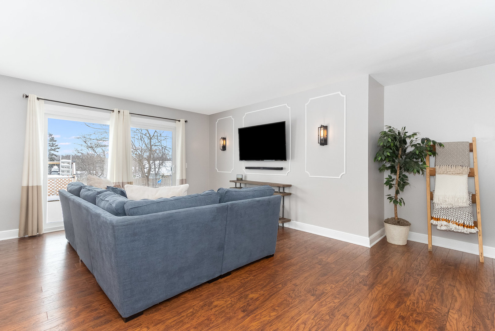 25 North Bereman Road Montgomery, IL 60538 - Photo 7 of 28 a living room with furniture and a flat screen tv