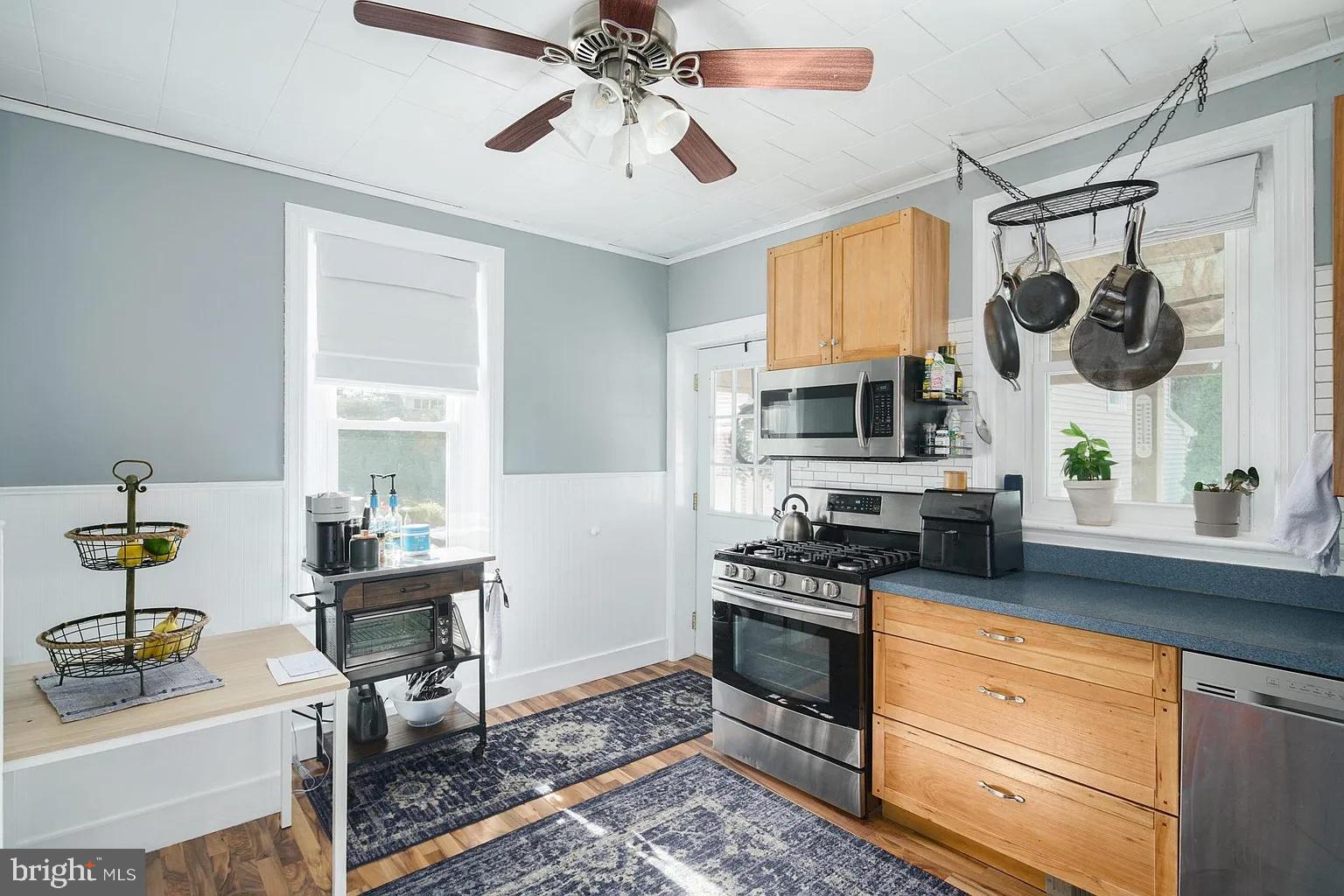 19 West Summit Avenue Haddonfield, NJ 08033 - Photo 2 of 12 a kitchen with stainless steel appliances kitchen island granite countertop a stove and a sink
