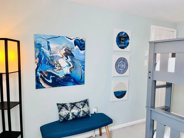 a view of entryway and hall with a wooden floor