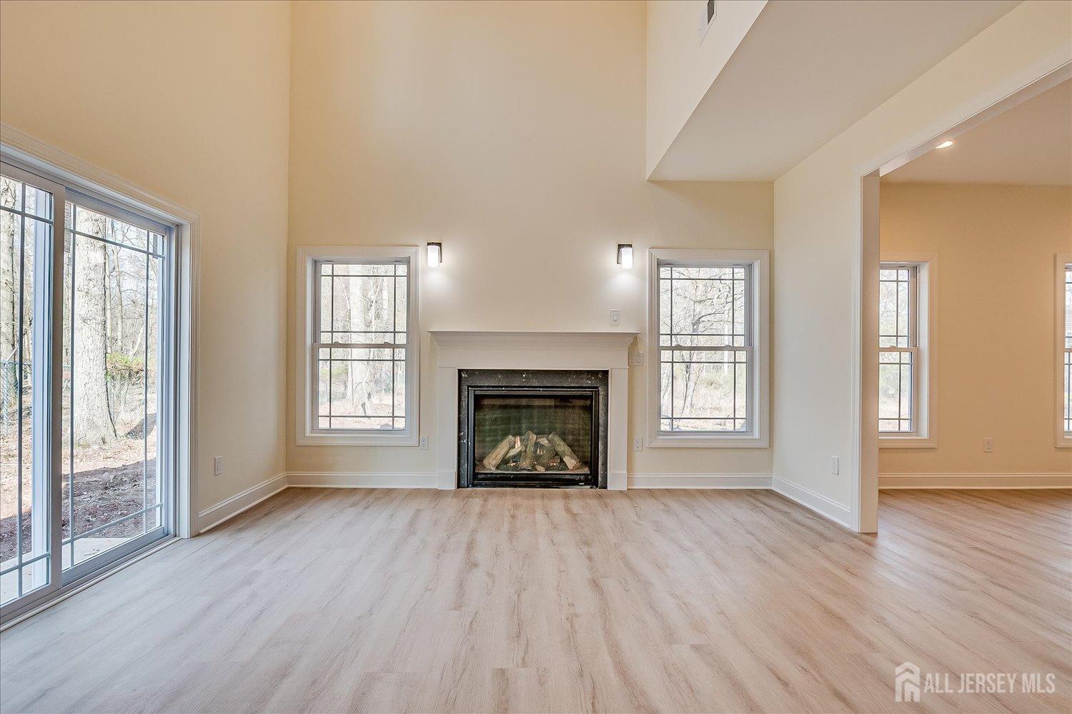 90 Hancock Road Piscataway, NJ 08854 - Photo 13 of 50 wooden floor fireplace and windows in an empty room