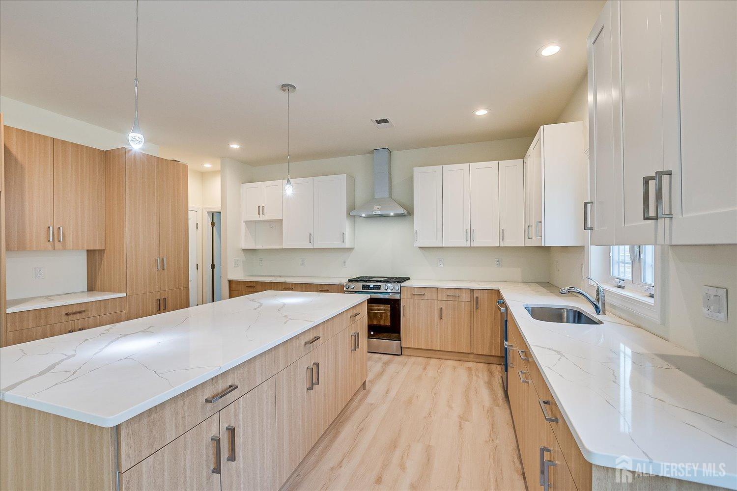 90 Hancock Road Piscataway, NJ 08854 - Photo 15 of 50 a kitchen with a sink a stove and cabinets