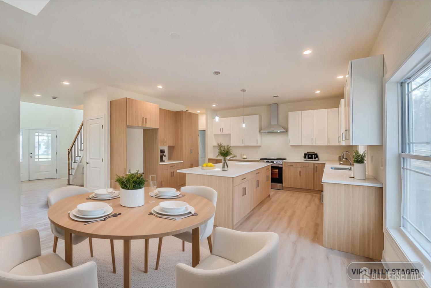 90 Hancock Road Piscataway, NJ 08854 - Photo 16 of 50 a large kitchen with a table and chairs in it