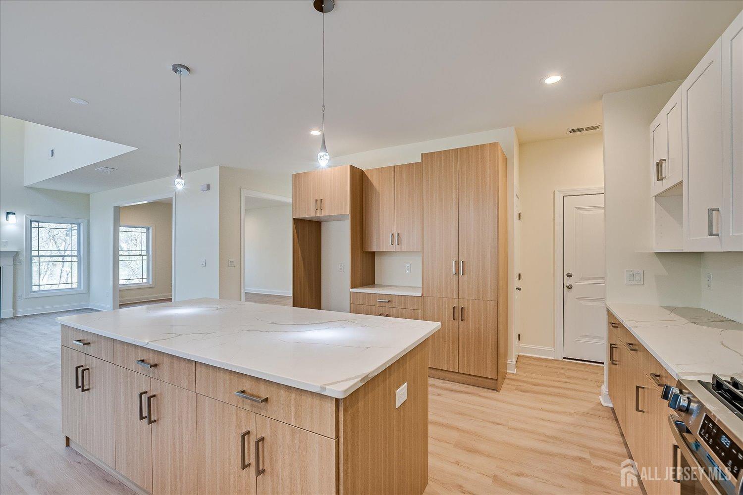 90 Hancock Road Piscataway, NJ 08854 - Photo 19 of 50 a kitchen with kitchen island a sink appliances and cabinets