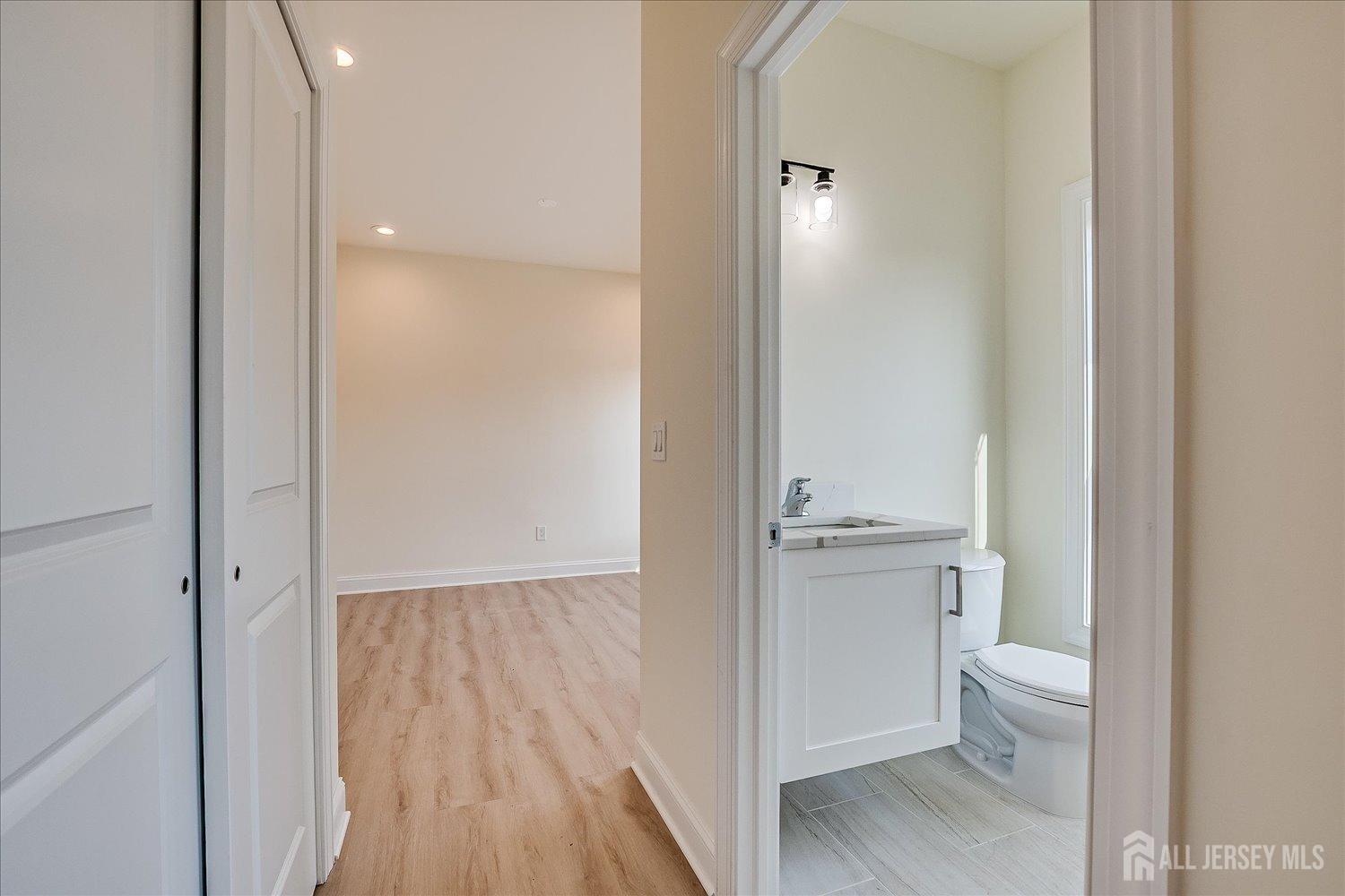 90 Hancock Road Piscataway, NJ 08854 - Photo 23 of 50 a view of bathroom with a toilet a sink and a mirror