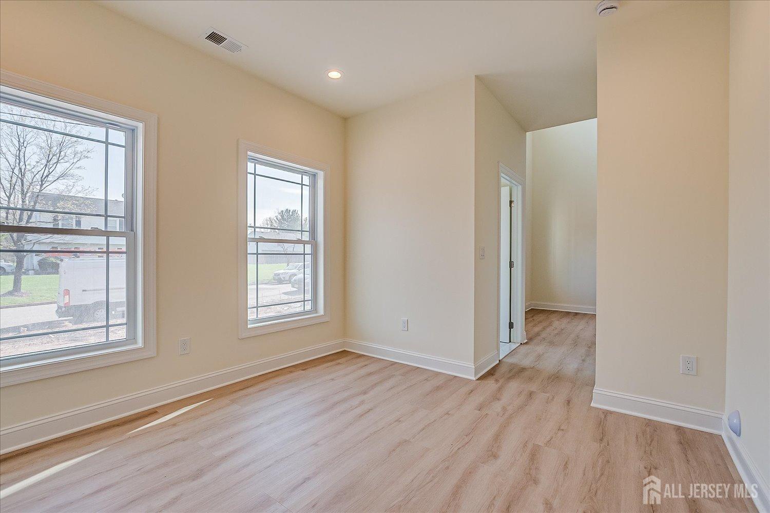90 Hancock Road Piscataway, NJ 08854 - Photo 25 of 50 a view of an empty room with wooden floor and a window