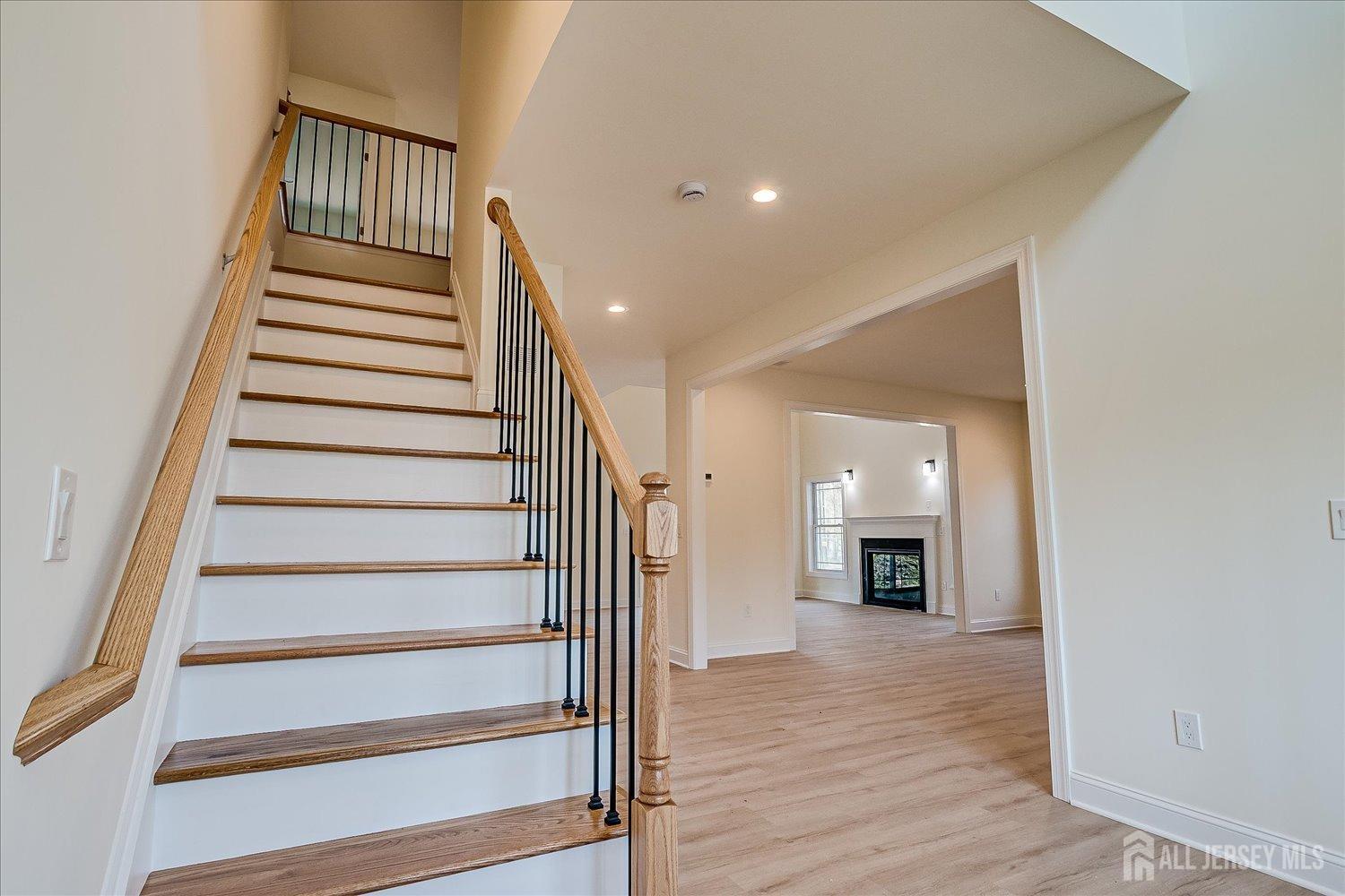 90 Hancock Road Piscataway, NJ 08854 - Photo 27 of 50 a view of hall with wooden floor and a fireplace