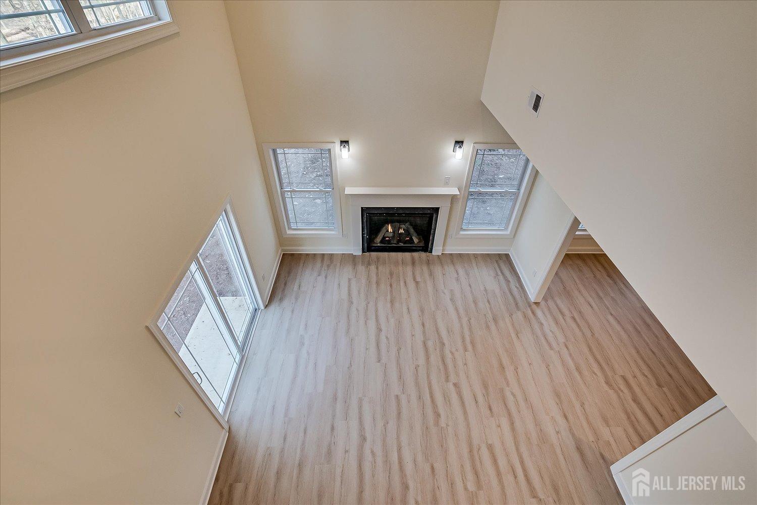 90 Hancock Road Piscataway, NJ 08854 - Photo 28 of 50 a view of an empty room with wooden floor and fireplace
