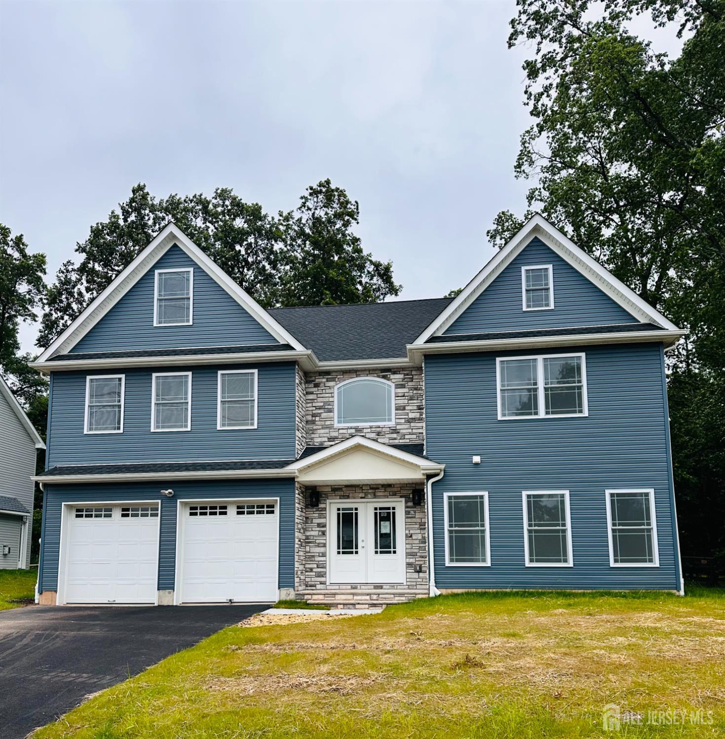 90 Hancock Road Piscataway, NJ 08854 - Photo 3 of 50 a front view of a house with a yard