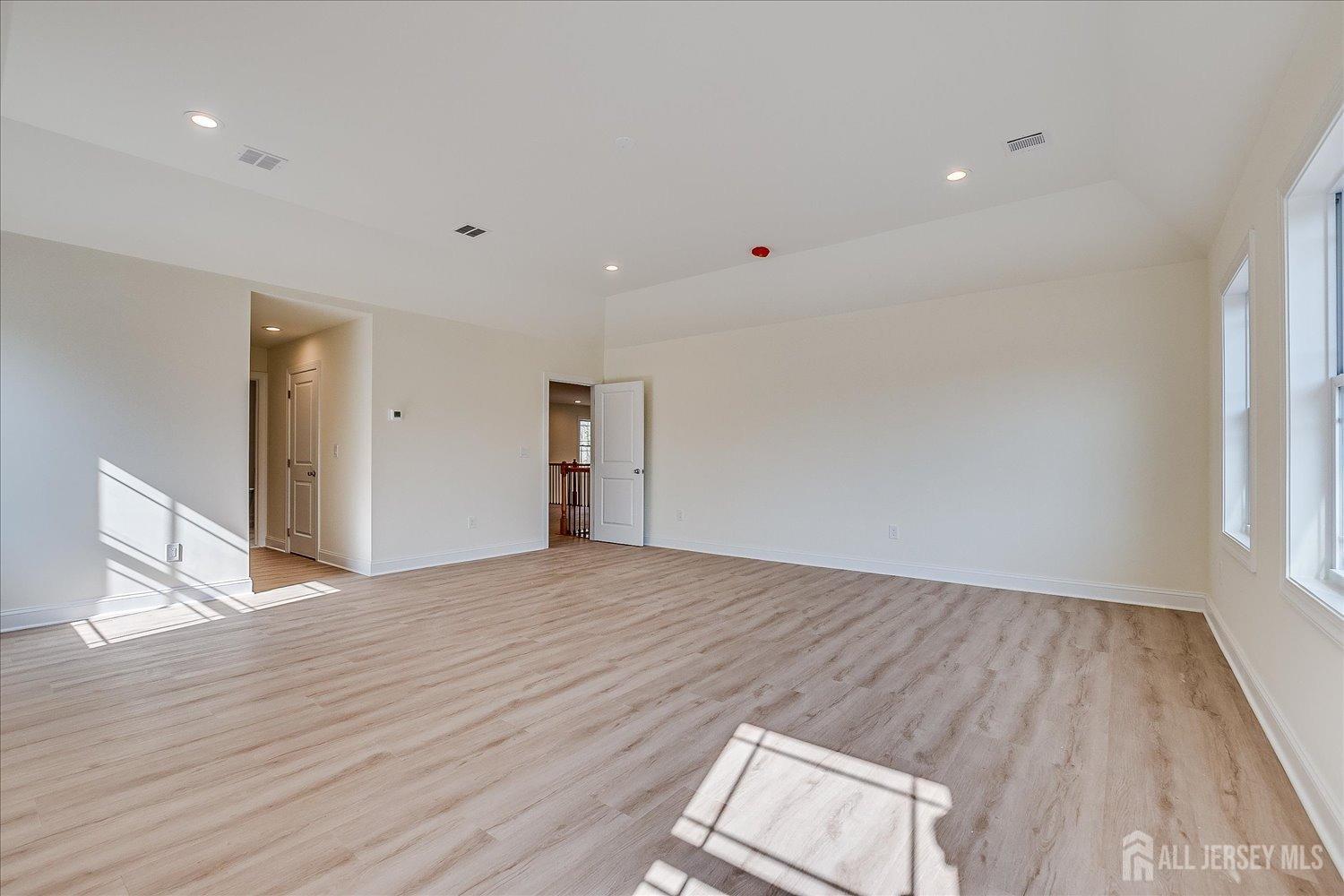 90 Hancock Road Piscataway, NJ 08854 - Photo 33 of 50 a view of empty room with wooden floor and fan