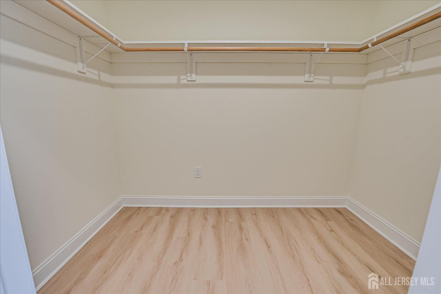 90 Hancock Road Piscataway, NJ 08854 - Photo 35 of 50 a view of walk in closet with empty racks