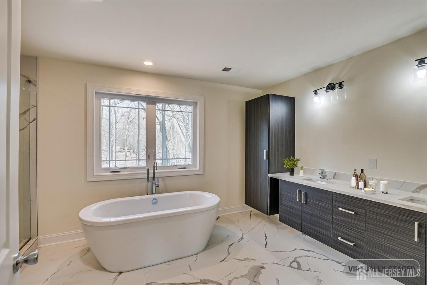 90 Hancock Road Piscataway, NJ 08854 - Photo 36 of 50 a spacious bathroom with a bathtub and sink