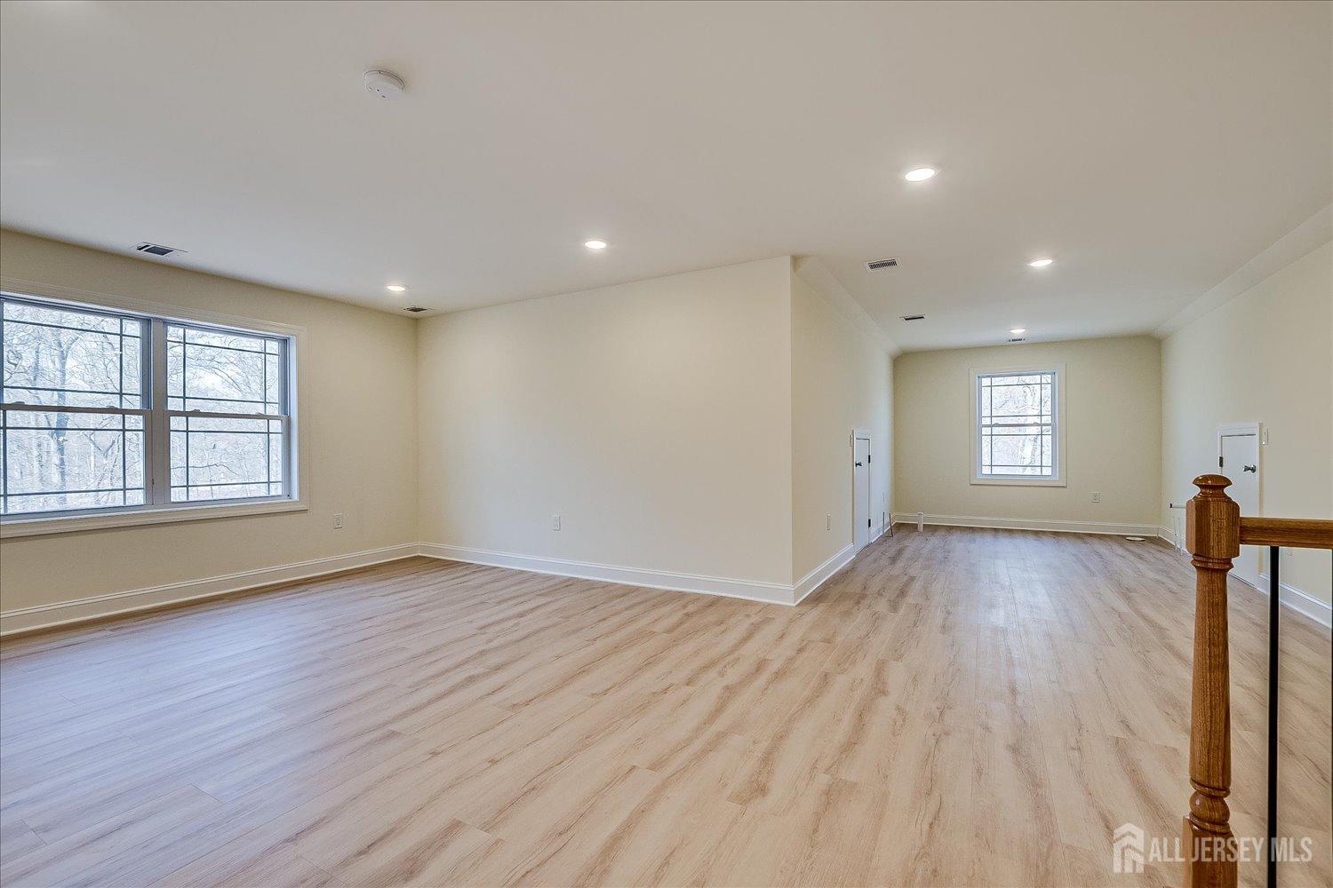 90 Hancock Road Piscataway, NJ 08854 - Photo 47 of 50 a view of empty room with window and wooden floor