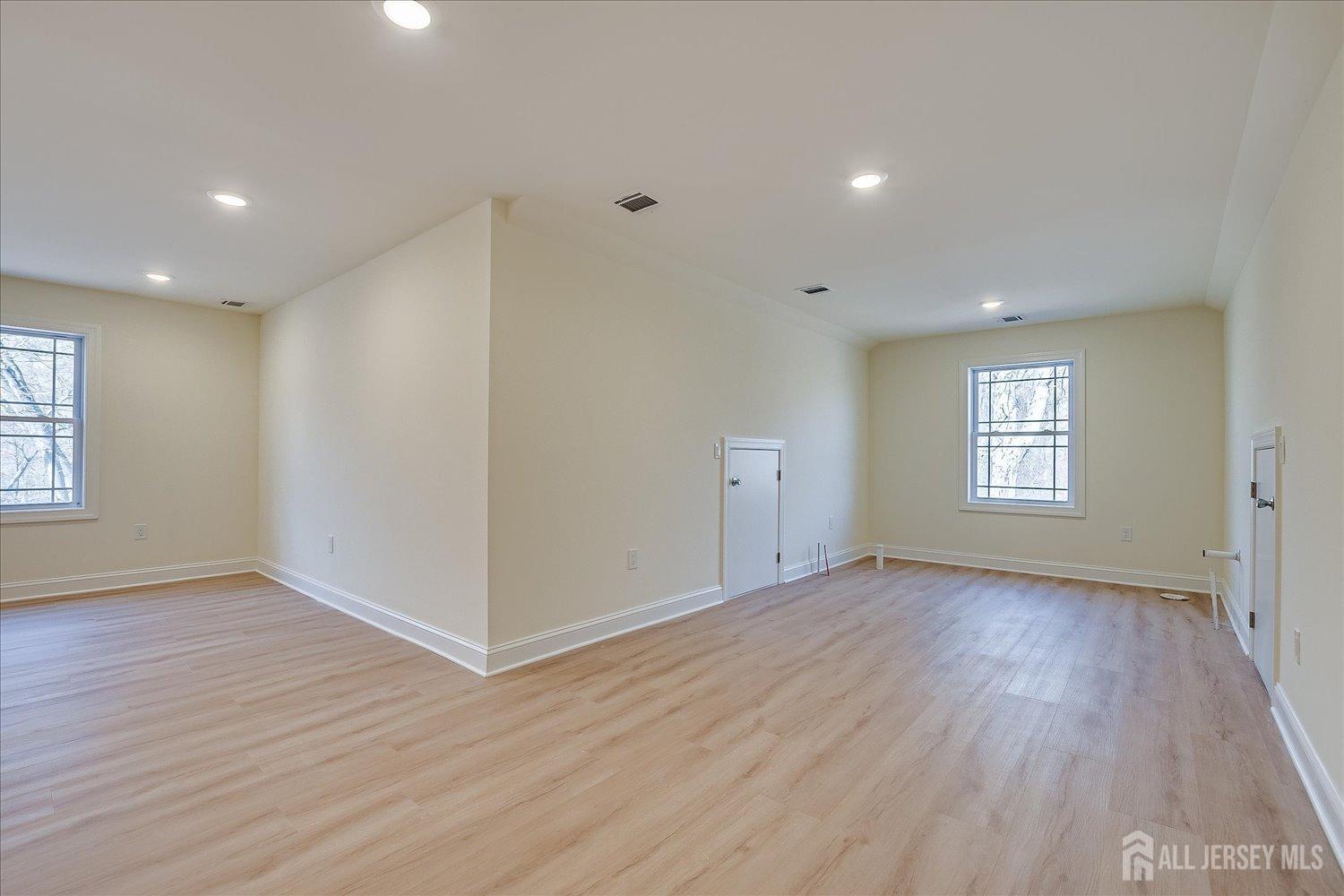 90 Hancock Road Piscataway, NJ 08854 - Photo 48 of 50 a view of an empty room with wooden floor and a window