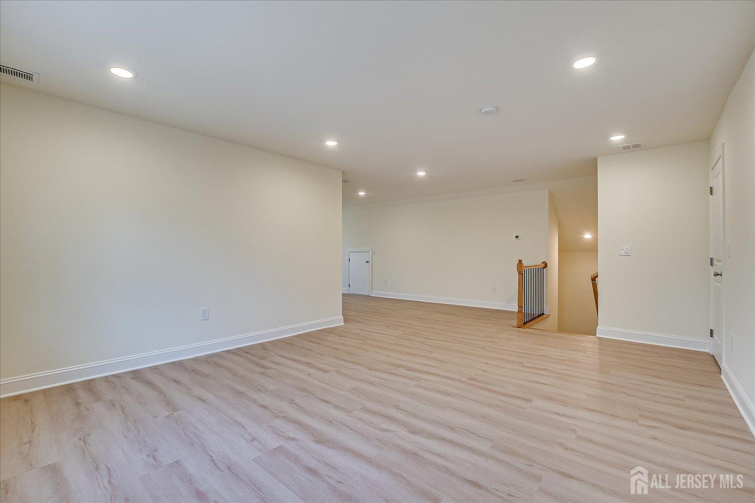 90 Hancock Road Piscataway, NJ 08854 - Photo 50 of 50 a view of an empty room with wooden floor and a window