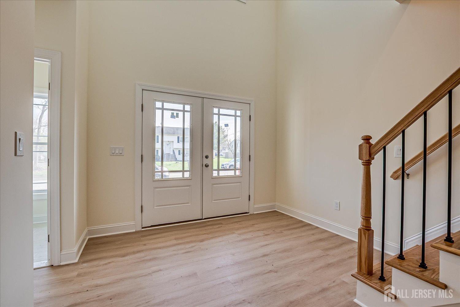 90 Hancock Road Piscataway, NJ 08854 - Photo 5 of 50 a view of an empty room with wooden floor and a window