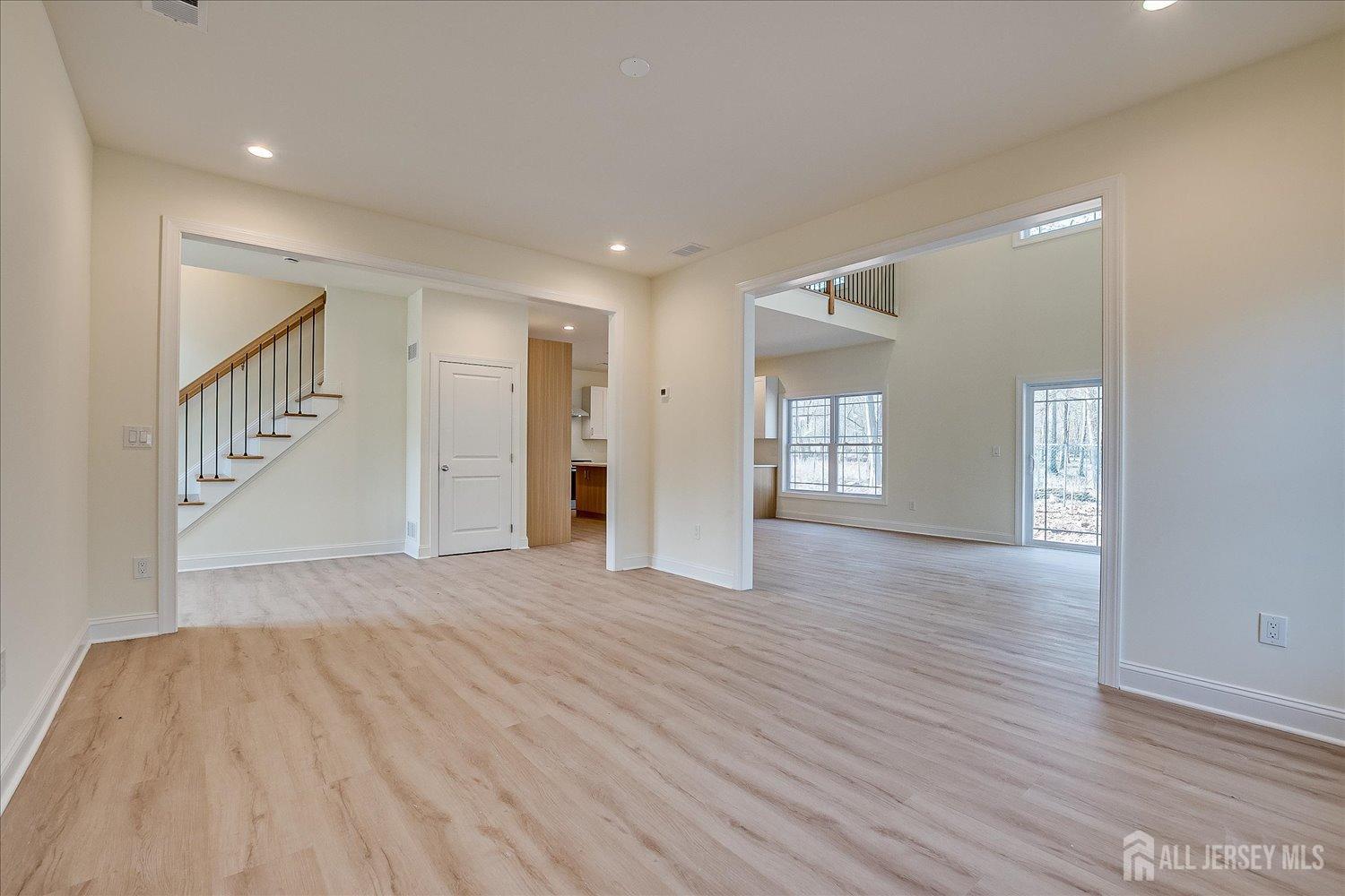 90 Hancock Road Piscataway, NJ 08854 - Photo 7 of 50 a view of an empty room and wooden floor