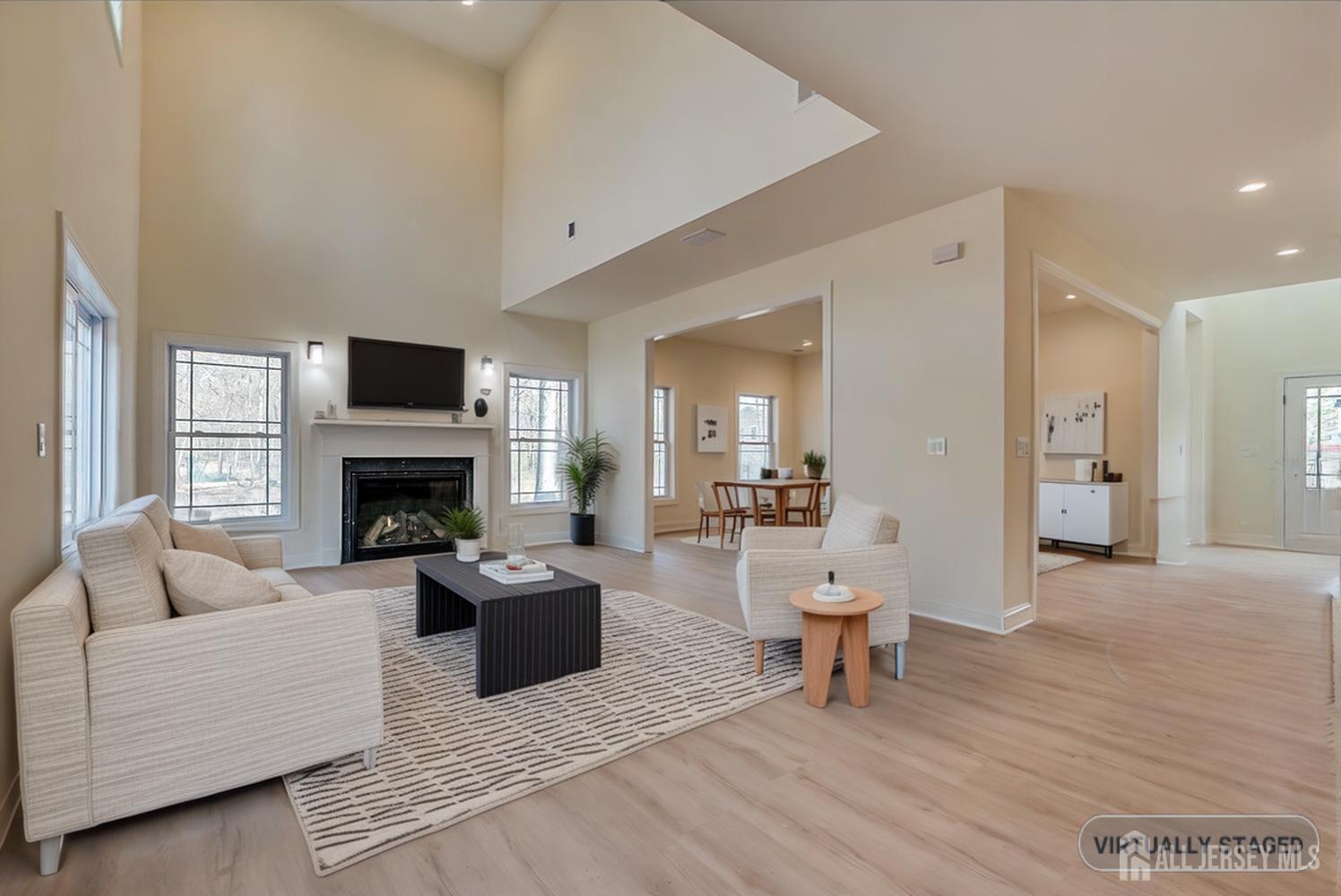 90 Hancock Road Piscataway, NJ 08854 - Photo 8 of 50 a living room with furniture a fireplace and a flat screen tv