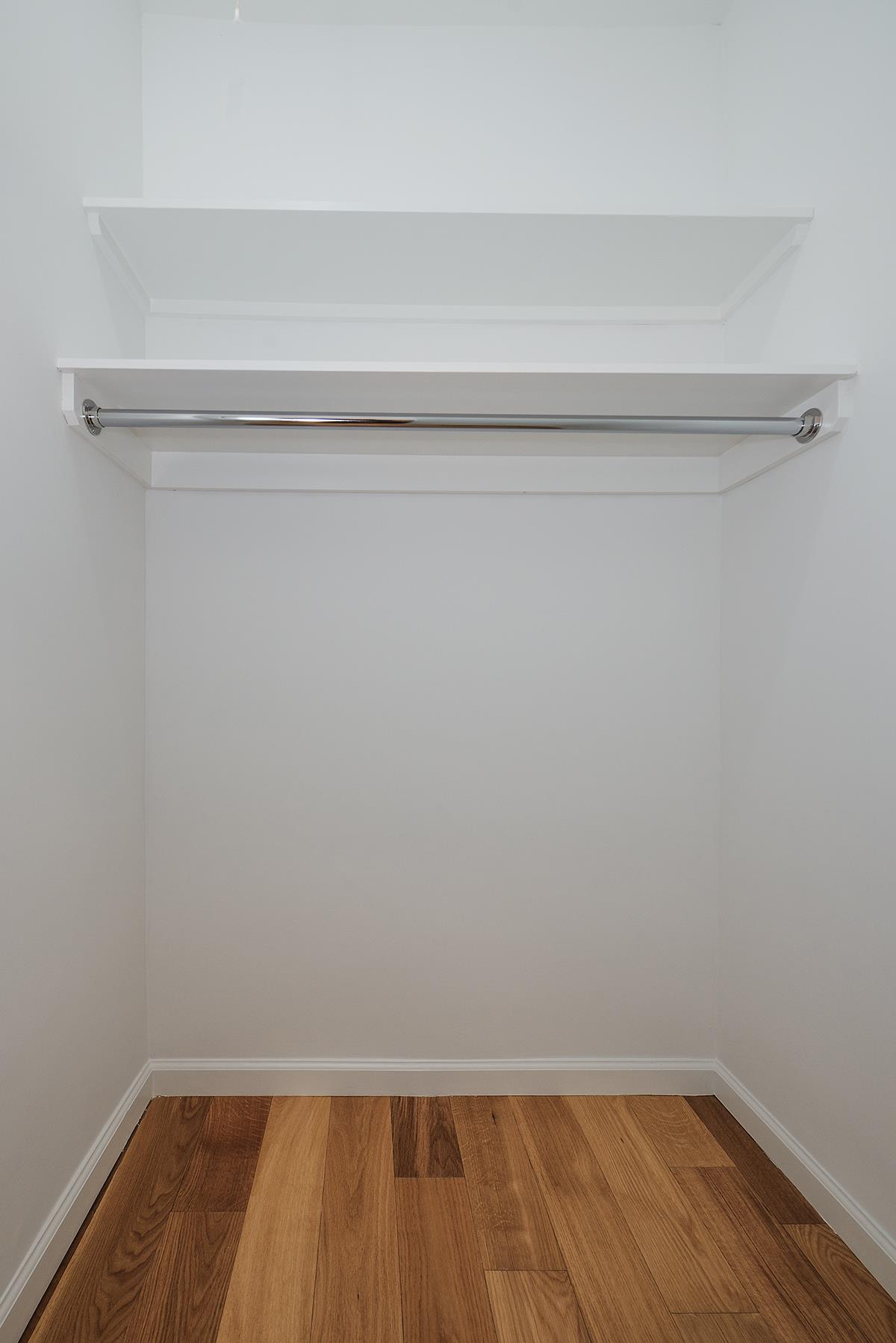 60 East 8th Street, Unit 10P Manhattan, NY 10003 - Photo 6 of 8 a view of small space with racks on the wall