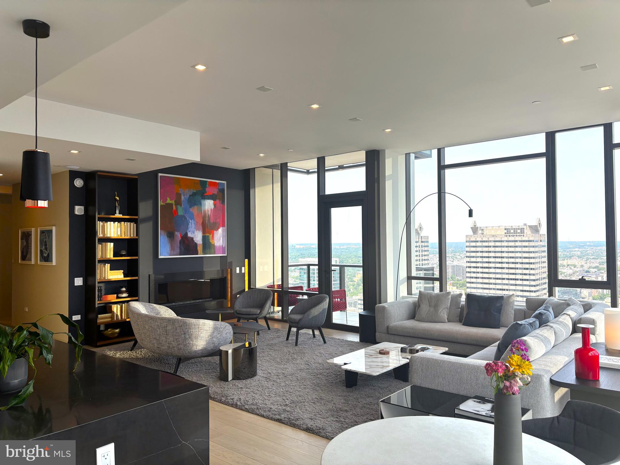 1911 Walnut Street, Unit 4102 Philadelphia, PA 19103 - Photo 3 of 25 a living room with furniture and a flat screen tv