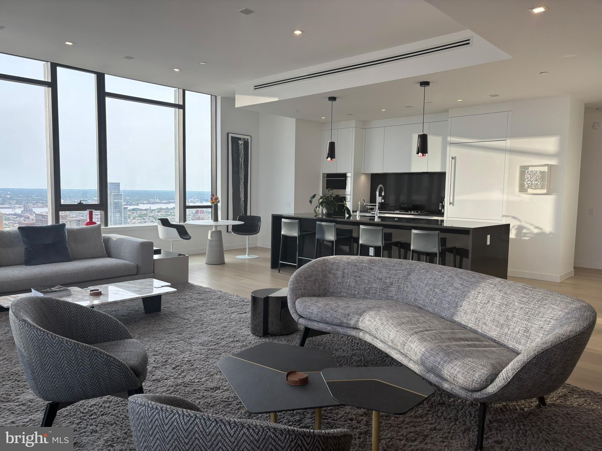 1911 Walnut Street, Unit 4102 Philadelphia, PA 19103 - Photo 25 of 25 a living room with furniture flat screen tv and a large window