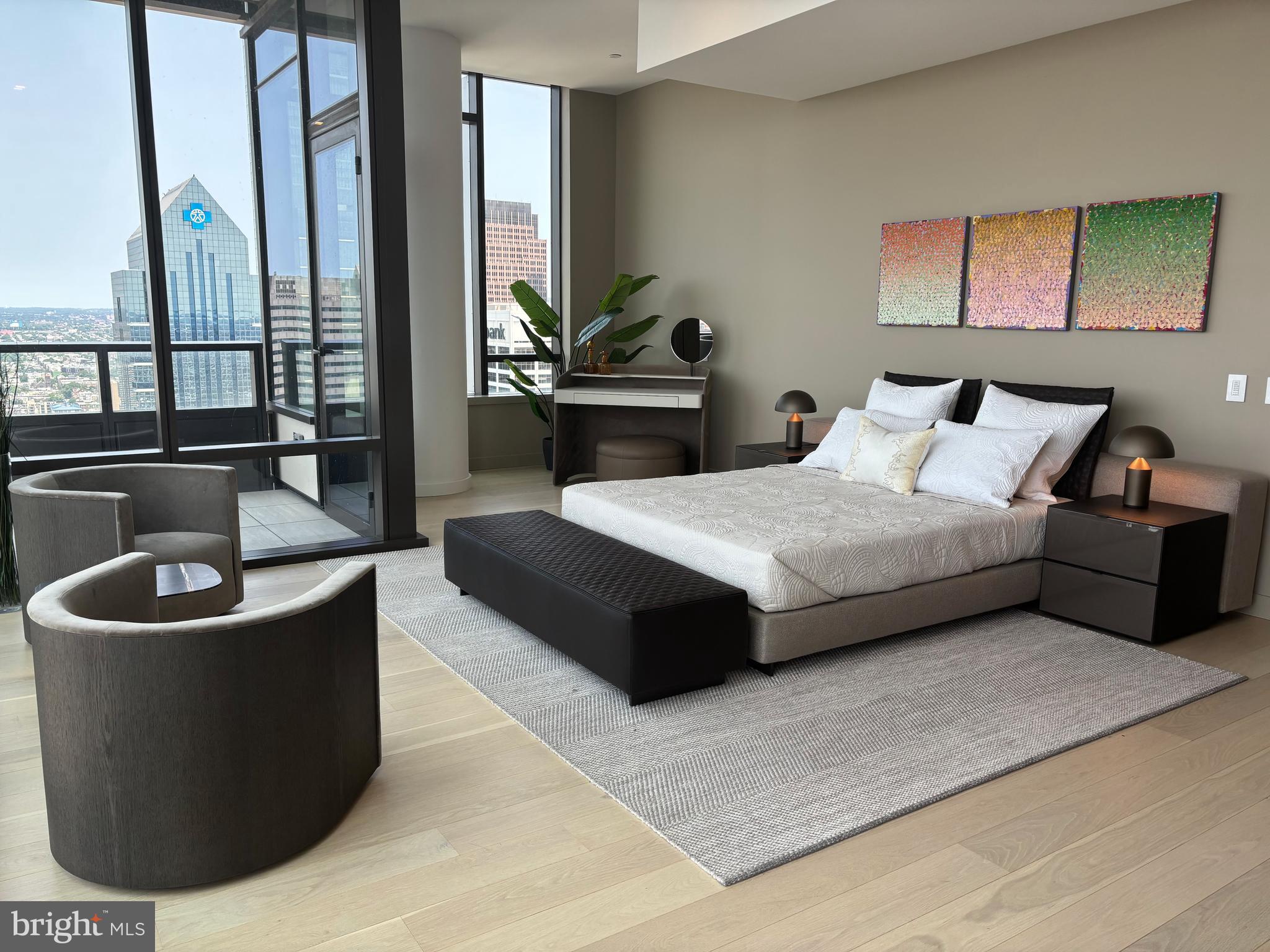 1911 Walnut Street, Unit 4102 Philadelphia, PA 19103 - Photo 4 of 25 a spacious bedroom with a bed and a couch