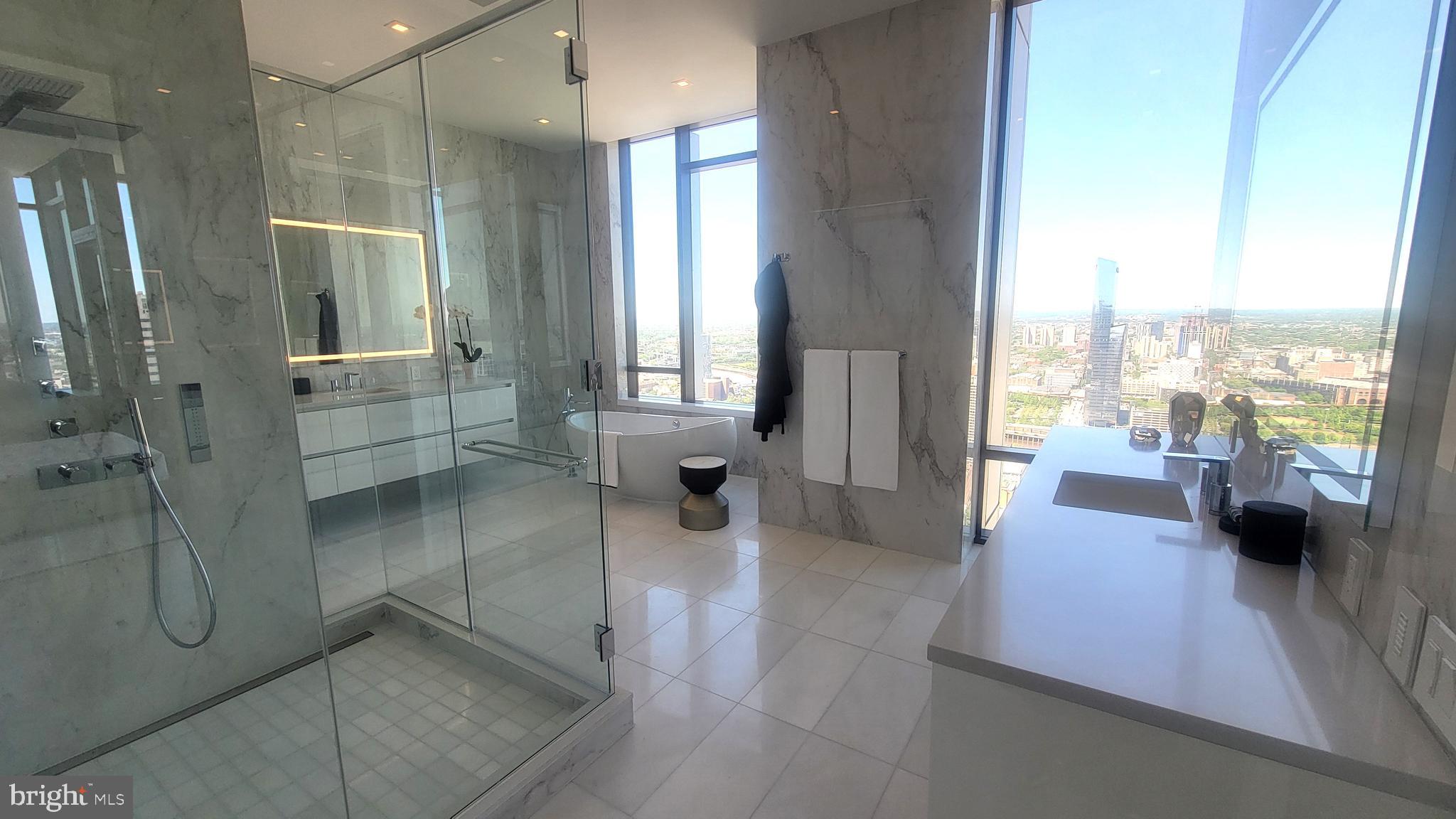 1911 Walnut Street, Unit 4102 Philadelphia, PA 19103 - Photo 5 of 25 a large en suite bathroom with toilet shower and tub