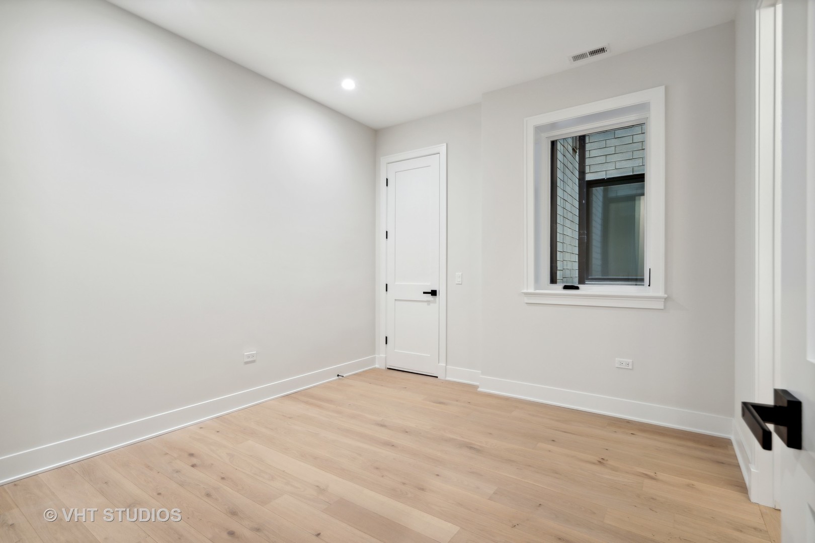 232 South Green Street, Unit 3N Chicago, IL 60607 - Photo 21 of 30 a view of empty room with wooden floor
