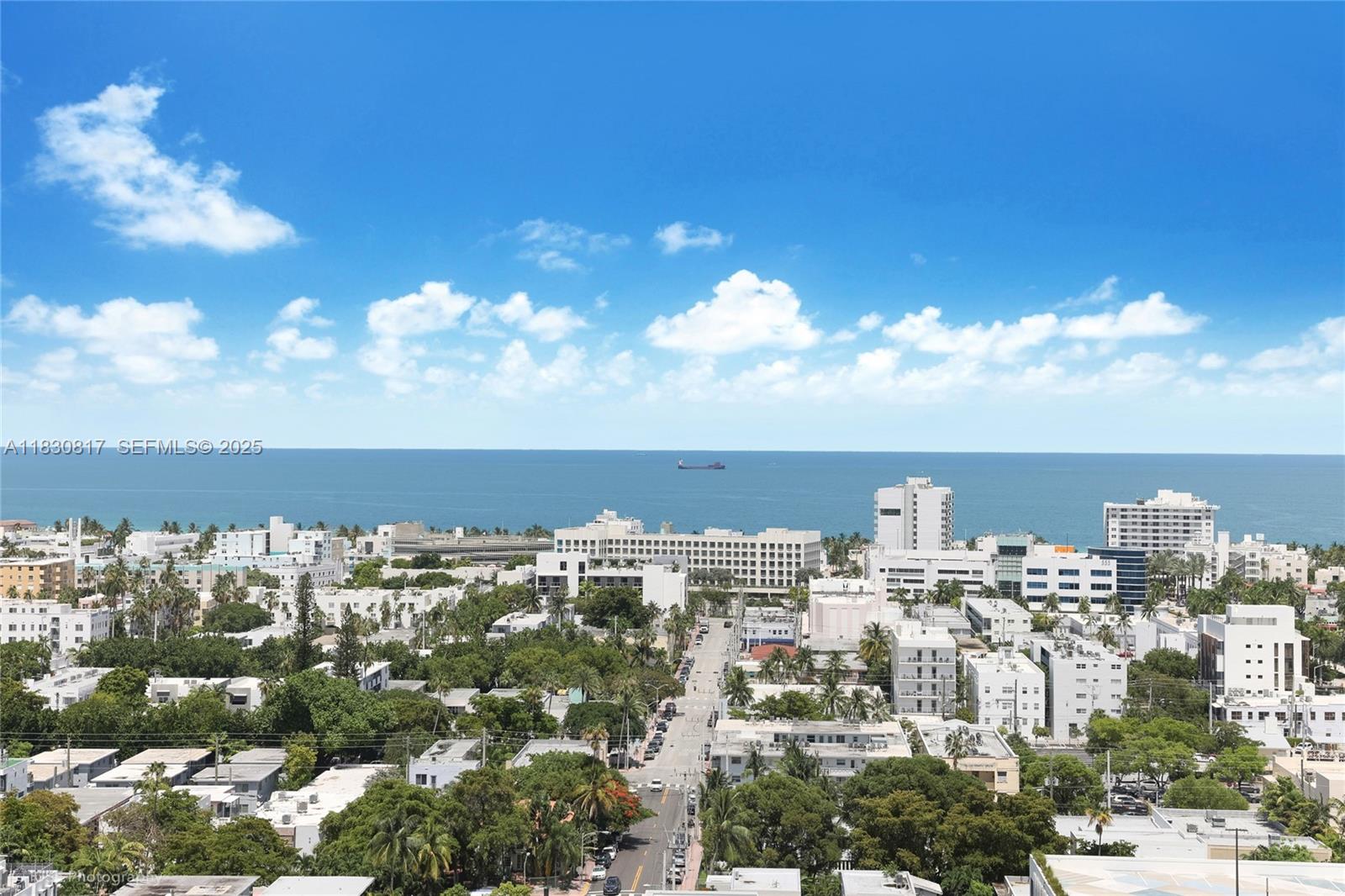 500 Alton Road, Unit 1906 Miami Beach, FL 33139 - Photo 13 of 19 a view of a city with lots of residential buildings ocean and mountain view in back