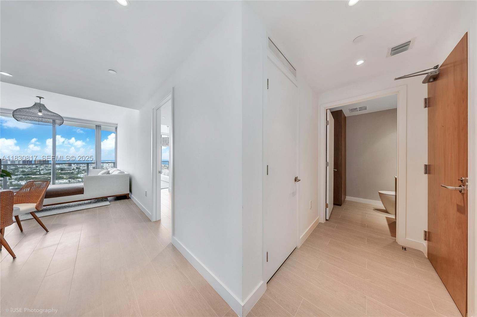 500 Alton Road, Unit 1906 Miami Beach, FL 33139 - Photo 8 of 19 a view of a hallway with furniture and a bathroom