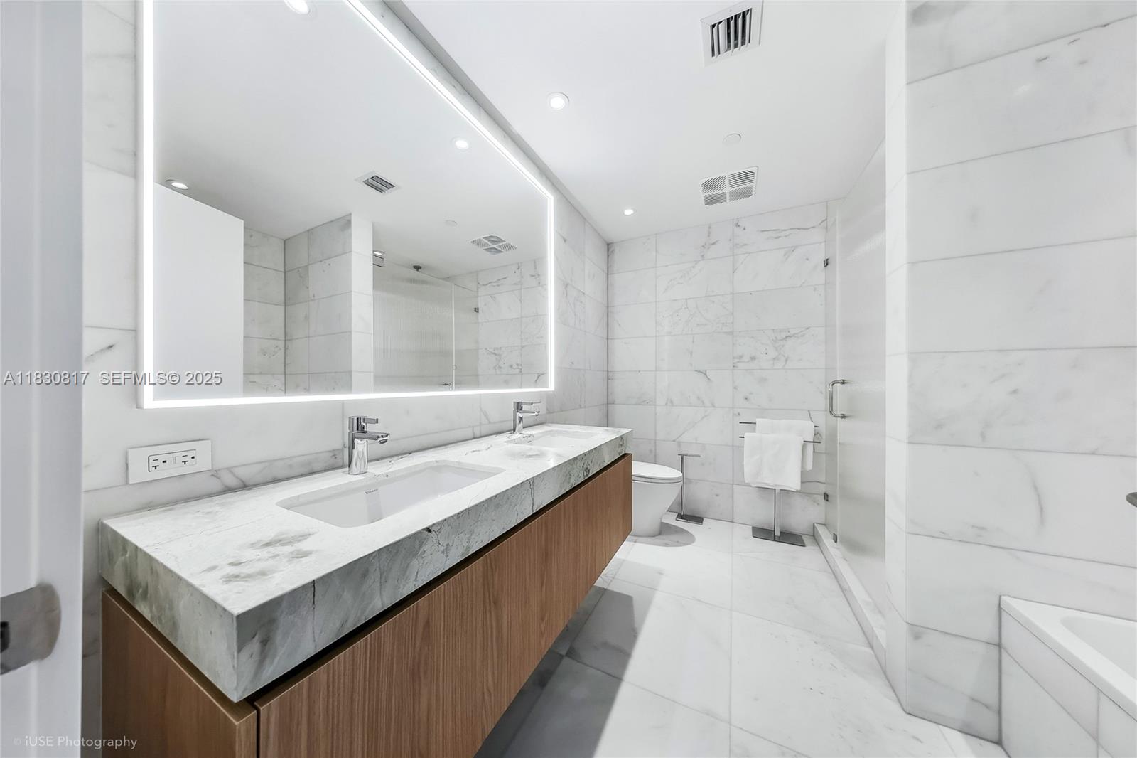 500 Alton Road, Unit 1906 Miami Beach, FL 33139 - Photo 9 of 19 a bathroom with a sink and a mirror