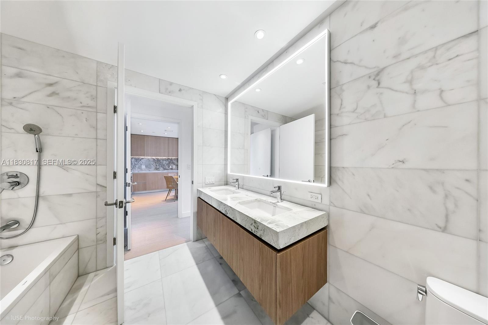 500 Alton Road, Unit 1906 Miami Beach, FL 33139 - Photo 10 of 19 a bathroom with a granite countertop sink mirror and shower