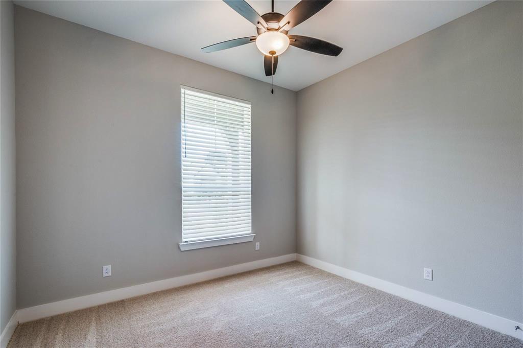 1309 Old Rocksprings Pass Mansfield, TX 76063 - Photo 22 of 36 Room featuring a window with blinds, light gray wall paint, white baseboards, and patterned carpet flooring