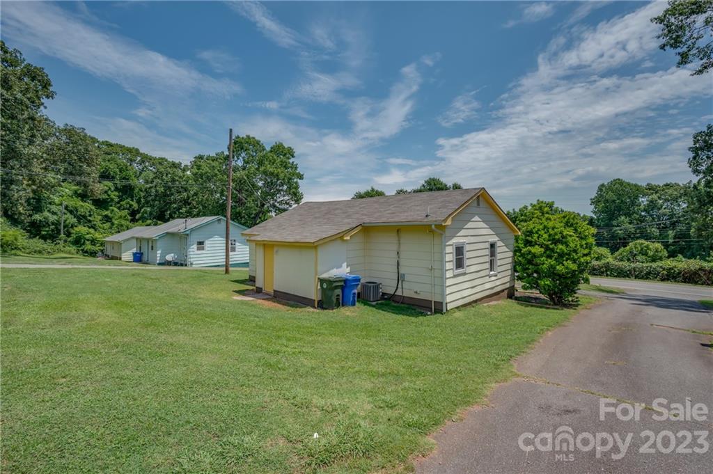 155 North Ridgecrest Avenue Rutherfordton, NC 28139 - Photo 17 of 18 a view of a house with a yard and large tree