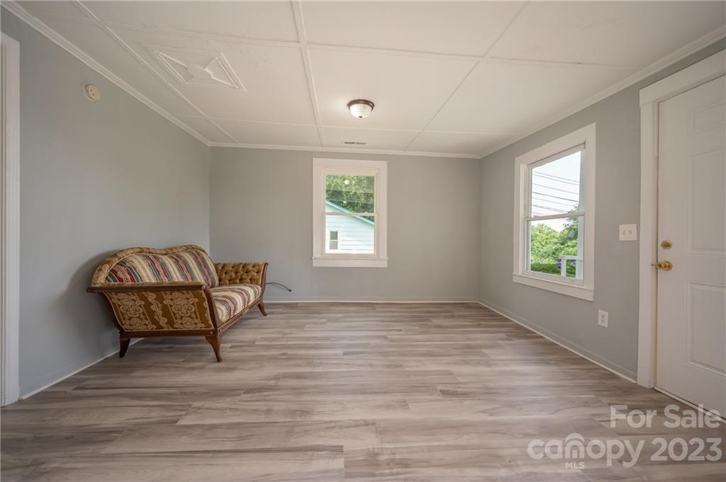 155 North Ridgecrest Avenue Rutherfordton, NC 28139 - Photo 5 of 18 a view of a room with window and wooden floor