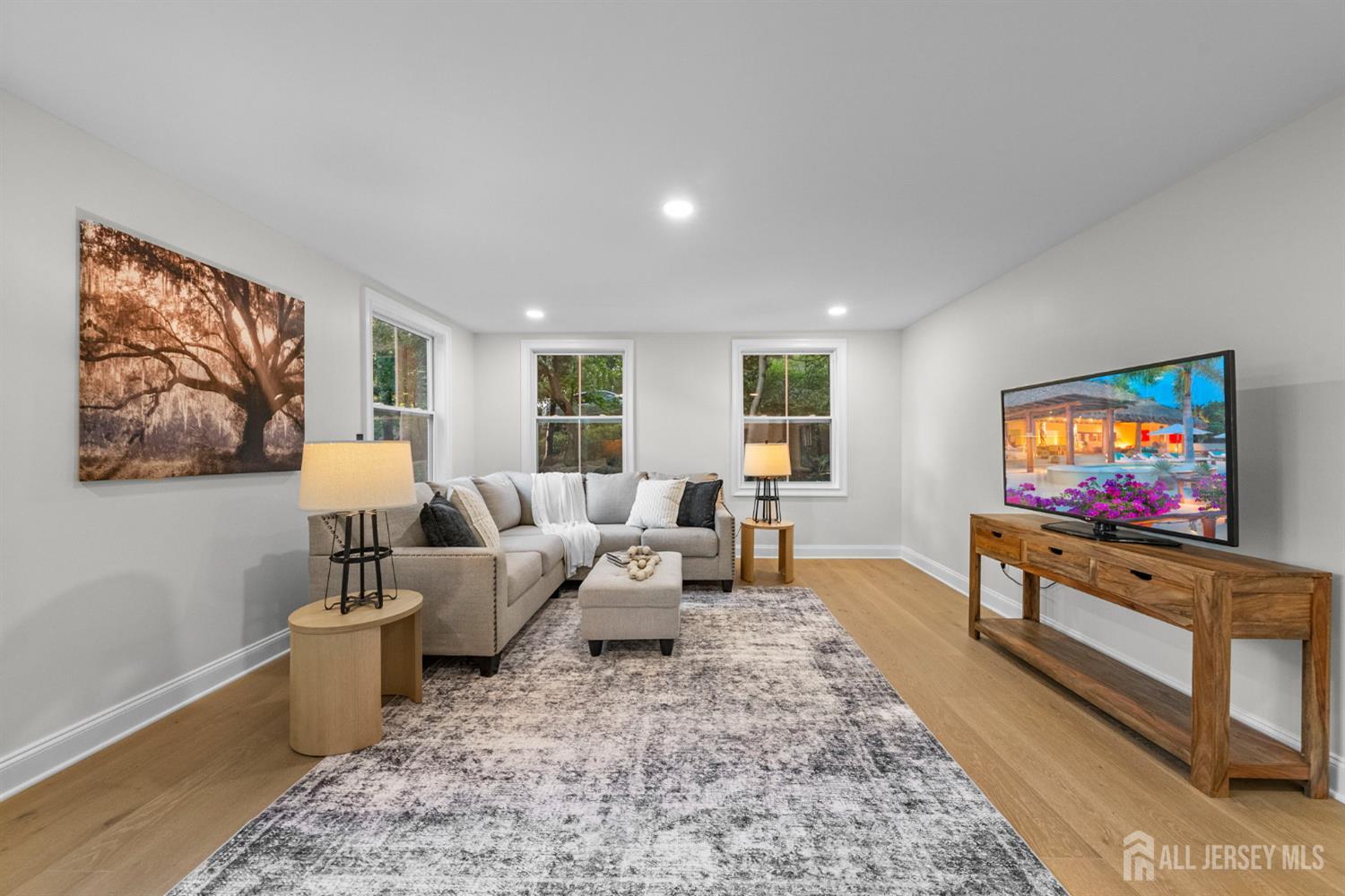 2 Beech Lane Edison, NJ 08820 - Photo 15 of 51 a living room with furniture and a flat screen tv