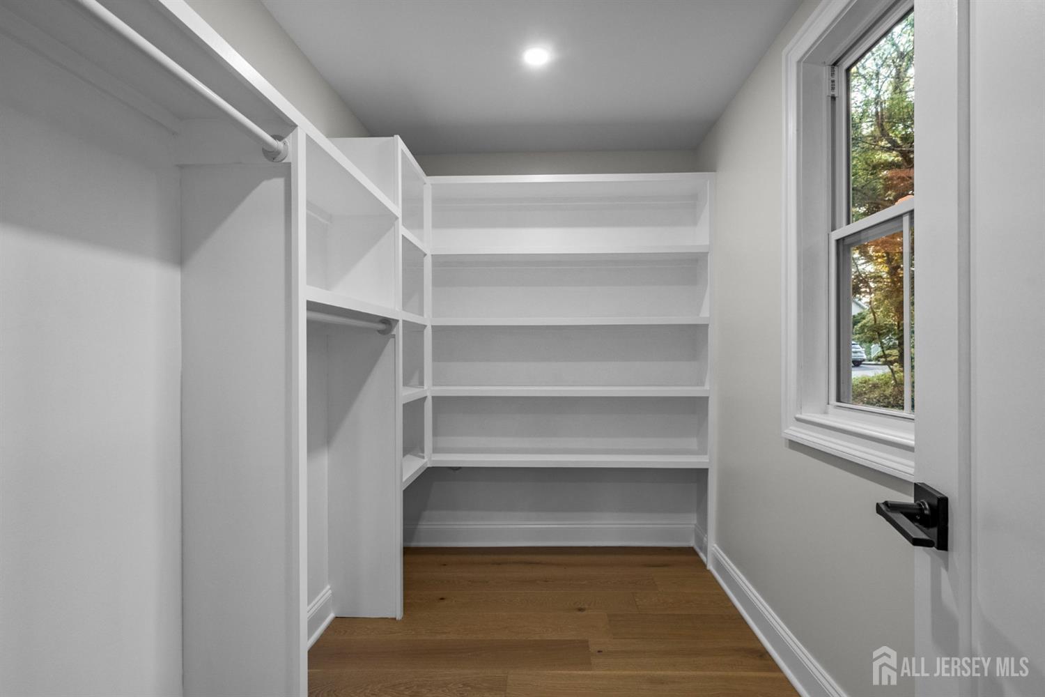 2 Beech Lane Edison, NJ 08820 - Photo 19 of 51 a view of walk in closet with empty racks
