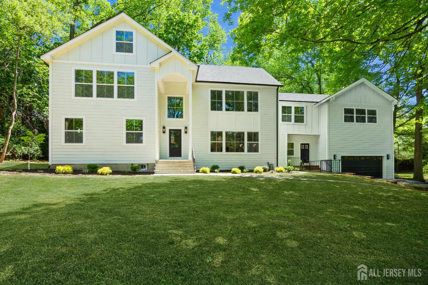 2 Beech Lane Edison, NJ 08820 - Photo 2 of 51 a front view of a house with a yard