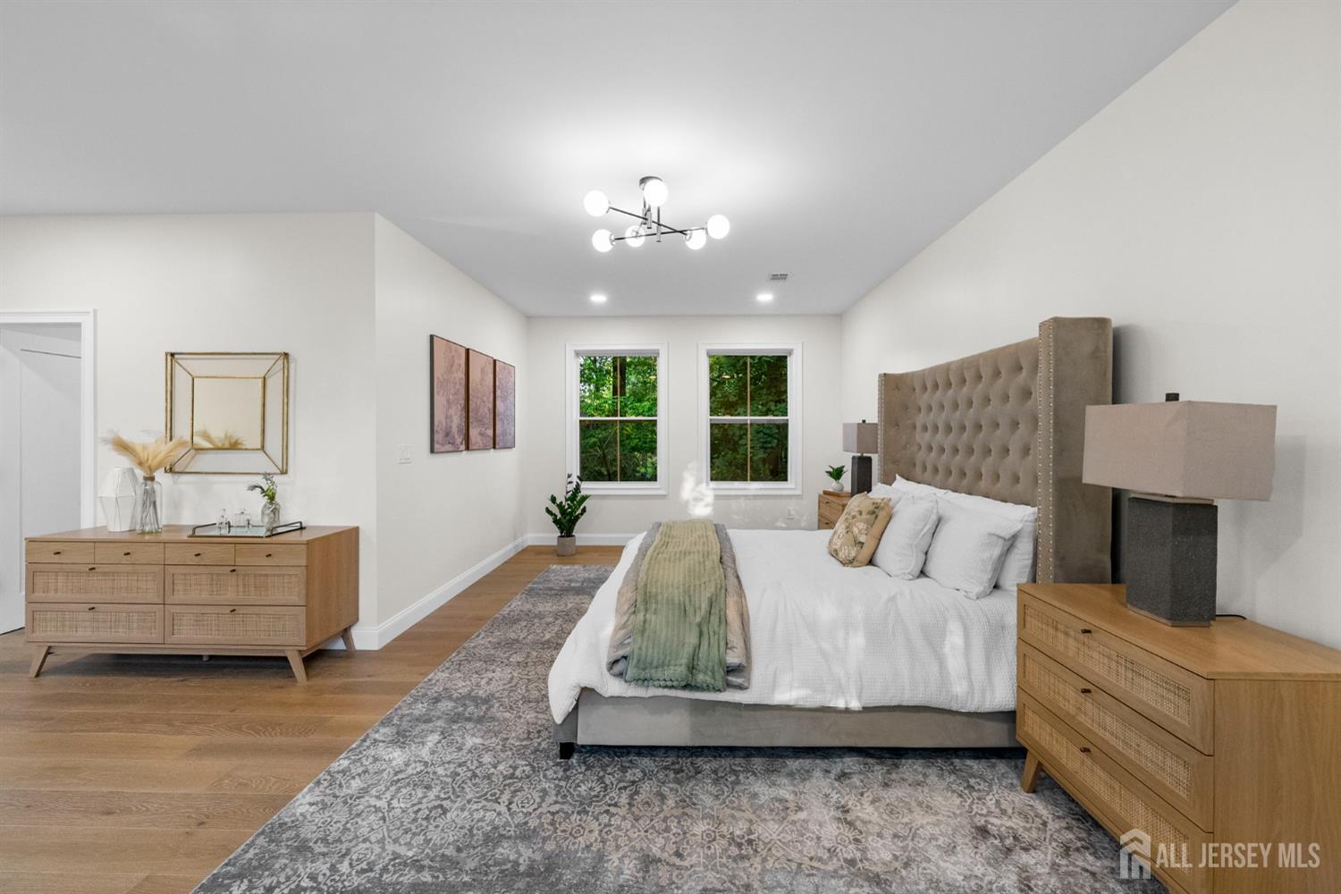 2 Beech Lane Edison, NJ 08820 - Photo 25 of 51 a living room with furniture and a chandelier