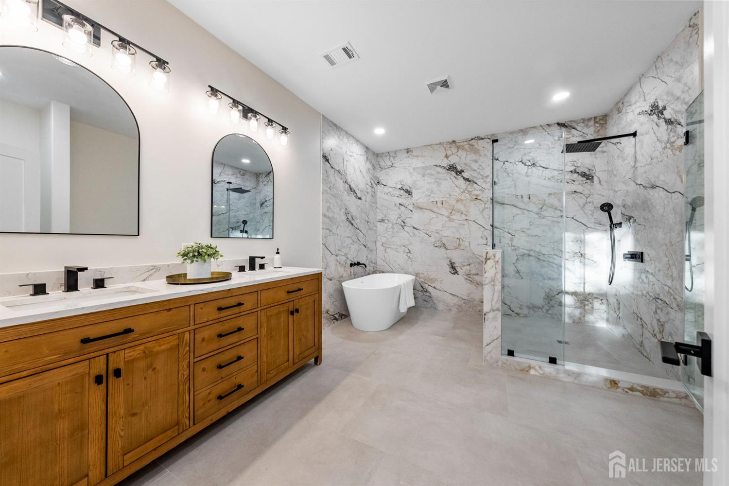 2 Beech Lane Edison, NJ 08820 - Photo 28 of 51 a spacious bathroom with double vanity and a mirror